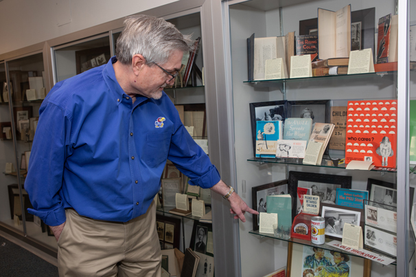 WORLD-CLASS COLLECTION: KU Distinguished Professor Michael Wehmeyer has assembled books and documents representing people with disabilities throughout history. Wehmeyer directs the Beach Center on Disability, where the collection is displayed.
Photo by Ann Dean