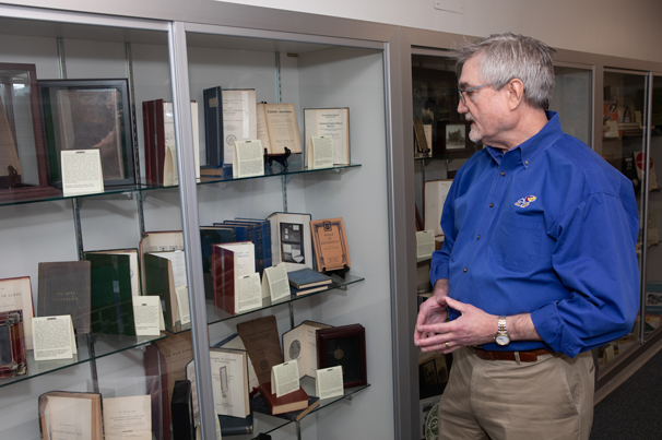 WORLD-CLASS COLLECTION: KU Distinguished Professor Michael Wehmeyer has assembled books and documents representing people with disabilities throughout history. Wehmeyer directs the Beach Center on Disability, where the collection is displayed.
Photo by Ann Dean