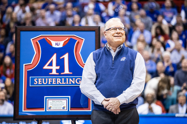 HALF-COURT HONORS: Kansas Athletics presents Dale with his own jersey as a thank you for his years of support.

Photo by Missy Minear / KU Athletics