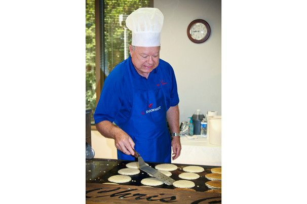 MASTER CHEF: Dale, who is often the cook at home, flips Chris Cakes pancakes for KU Endowment employees.

Photo by Melissa Meyer / KU Endowment