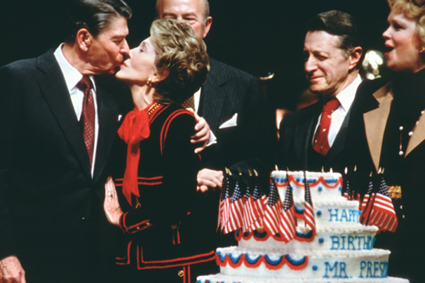 President Ronald Reagan received a kiss from his wife, Nancy, on his 75th birthday on Feb. 6, 1986, in Washington, D.C. Photo by Alan Hagman