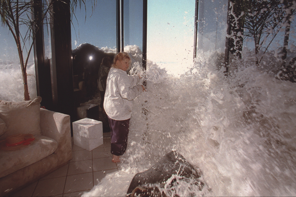 While talking to homeowners Marilyn and Ben Lane, a rogue wave reared up and slammed into the home. Marilyn Lane rushed to try and close the door, but the giant wave came crashing into the house. Hagman instinctively caught the moment, squeezing off four shots as the wave hit him and pushed him against a wall. This image landed on the front page and ran in newspapers and magazines around the world.
(Los Angeles Times, Jan. 31, 1998) Photo by Alan Hagman