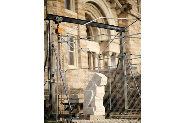CARVING STATION: Sculptor Karl Ramberg, with the help of KU students, used hand tools to shape 1,600-pound slabs of Cottonwood limestone into a blocky animal-like shapes to start the carving process for the grotesques.

Photo by University of Kansas/Meg Kumin