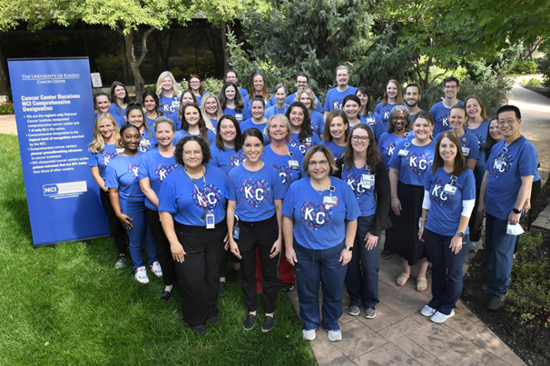 CANCER TEAM T-SHIRT: In celebration of achieving NCI Comprehensive Designation, KU Cancer Center partnered with Charlie Hustle Clothing Co. to create a themed t-shirt for their staff. Photo by KUMC/Elissa Monroe
