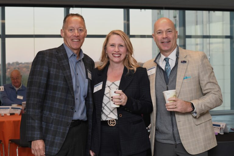 KU Advancement Board Members Jeff Yowell and Kirsten Flory with Shawn Long of The University of Kansas Health System