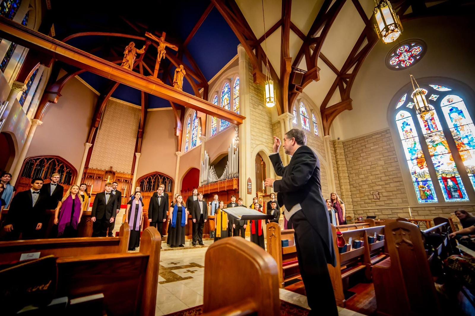 The chamber choir performing in a Polish church, conducted by Eduardo García-Novelli. Photo by Lena Pendleton.