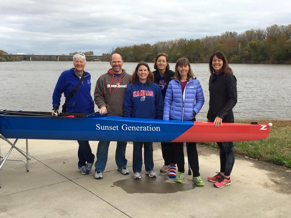 Crew Club alumni with the Sunset Generation shell. Courtesy Kelly and Ulf Becker.